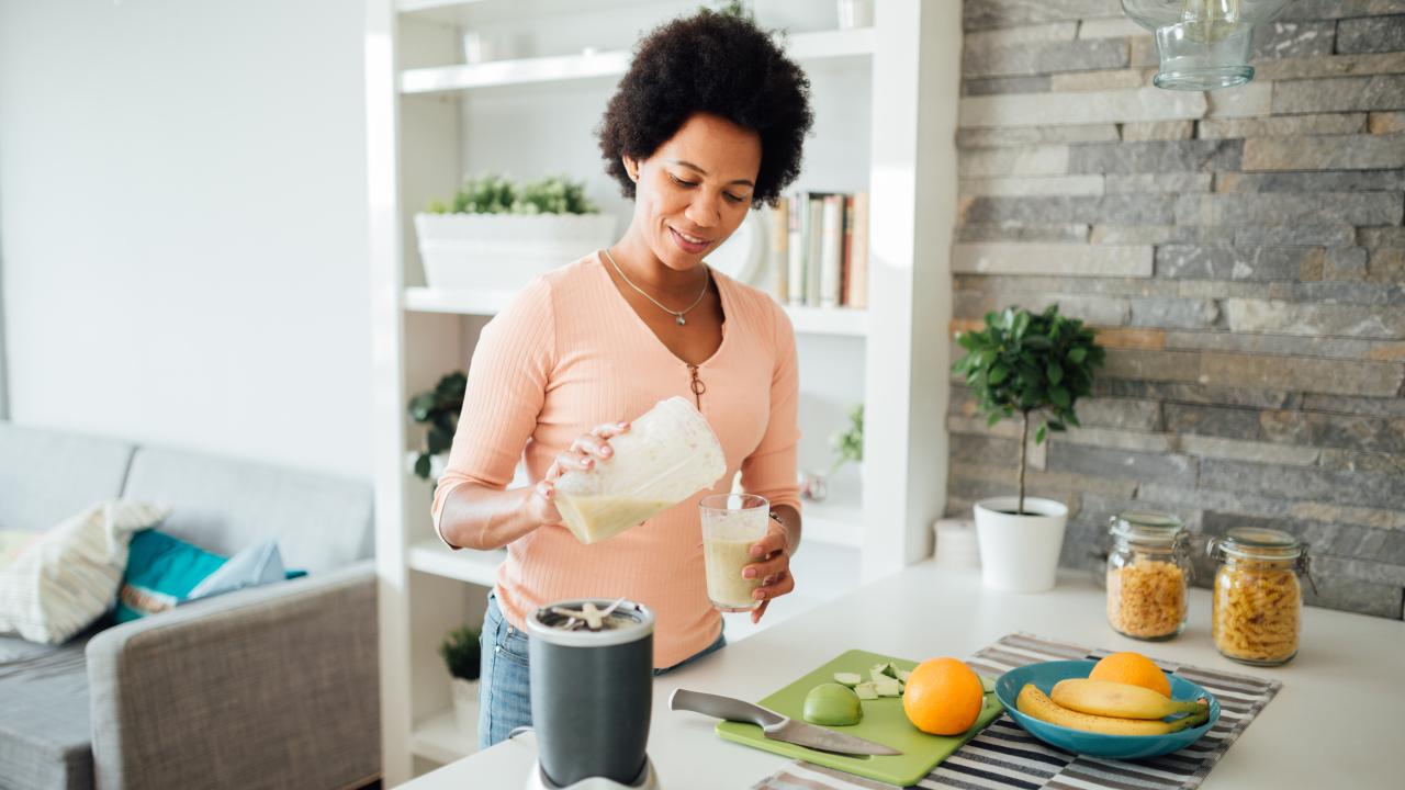 Woman making a smoothie