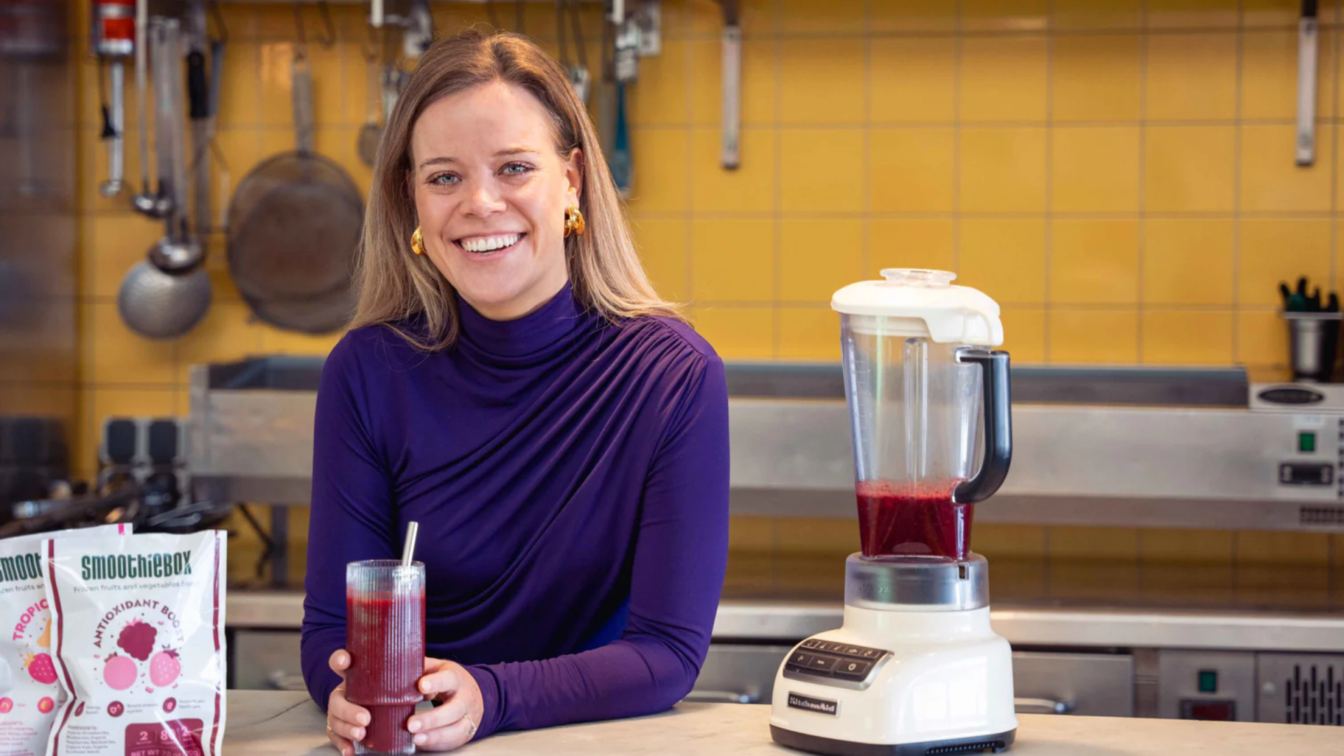 Woman at kitchen counter smiling