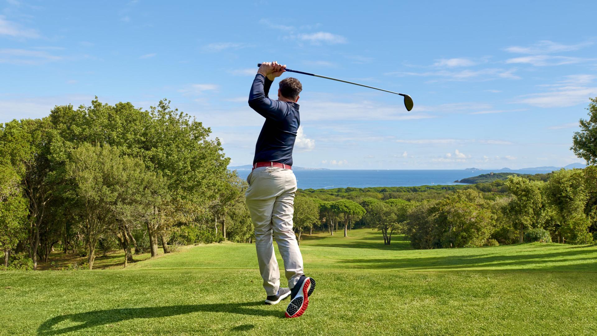 Man swinging golf club